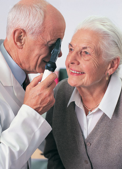Doctor Examining Female Patient's Eye With a Occluder at Eye Care Associates of Nevada in Verdi, NV